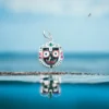Close-up of the intricate details on the Nila Chakra pendant of the silver Jagannath locket.