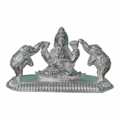 Lakshmi Murti, adorned with golden coins, symbolizing the flow of wealth and prosperity.