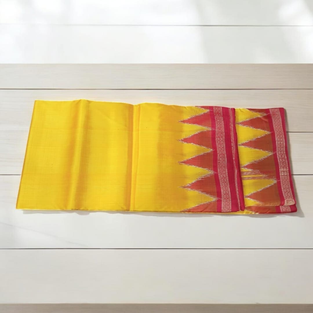 A Beautiful Yellow Silk Pata for Shri Jagannath Mahaprabhu draped over a statue of the deity.
