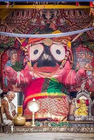 Colorful large-eyed deity figure in a pink robe, featured in the Varuthini Ekadashi article