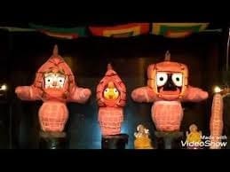 Three red cartoon characters, featured in the Banner Ceremony article